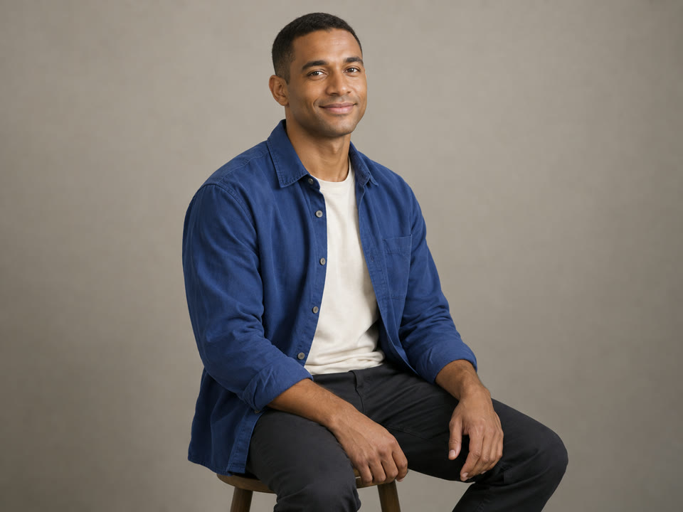 AI-generated adult man with short black hair and a cobalt blue overshirt